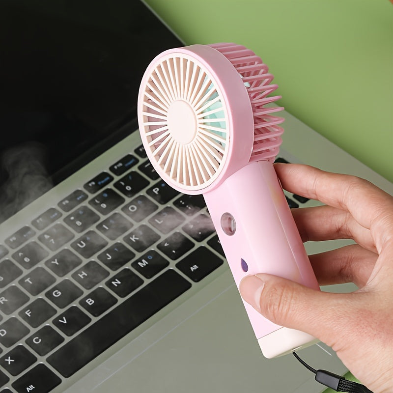 Portable Mini Handheld Fan with Mist Humidifier, Compact Size (14.22cm x 6.5cm x 3.51cm), Rechargeable Battery Power, Ideal for Travel and Desk Cooling