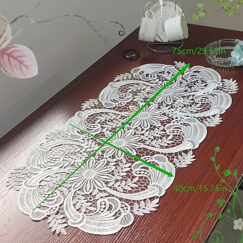 White velvet lace oval table runner with floral pattern, perfect for holiday table setting. Butterfly motif on decorative fabric for dining and home decor.