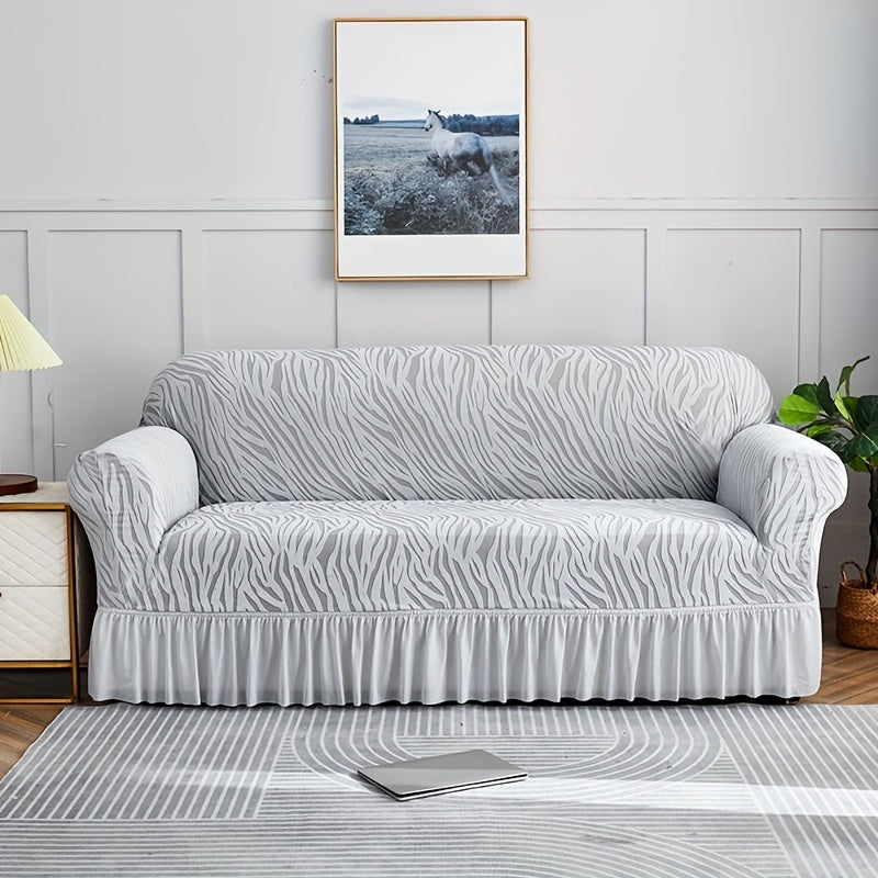 Wave pattern sofa slipcover with skirt, non-slip and dustproof. Protects furniture from cat scratches. Machine washable for easy cleaning. Suitable for bedroom, office, or living room décor.