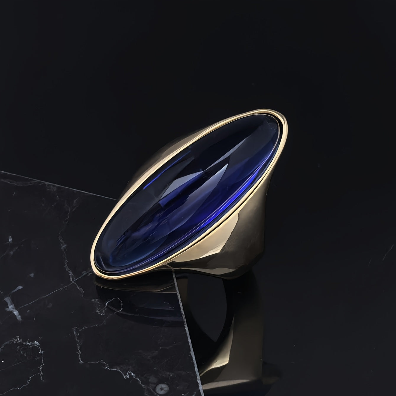 A beautiful stainless steel ring featuring an artificial blue sapphire, plated in elegant 18K gold. This luxury titanium steel women's jewelry is perfect for everyday wear and gifting.