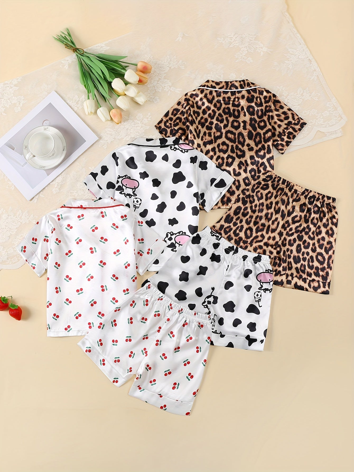 3-piece girl's ice silk clothing set features cute cow, rabbit, and leopard print. Comfortable and skin-friendly for daily wear.