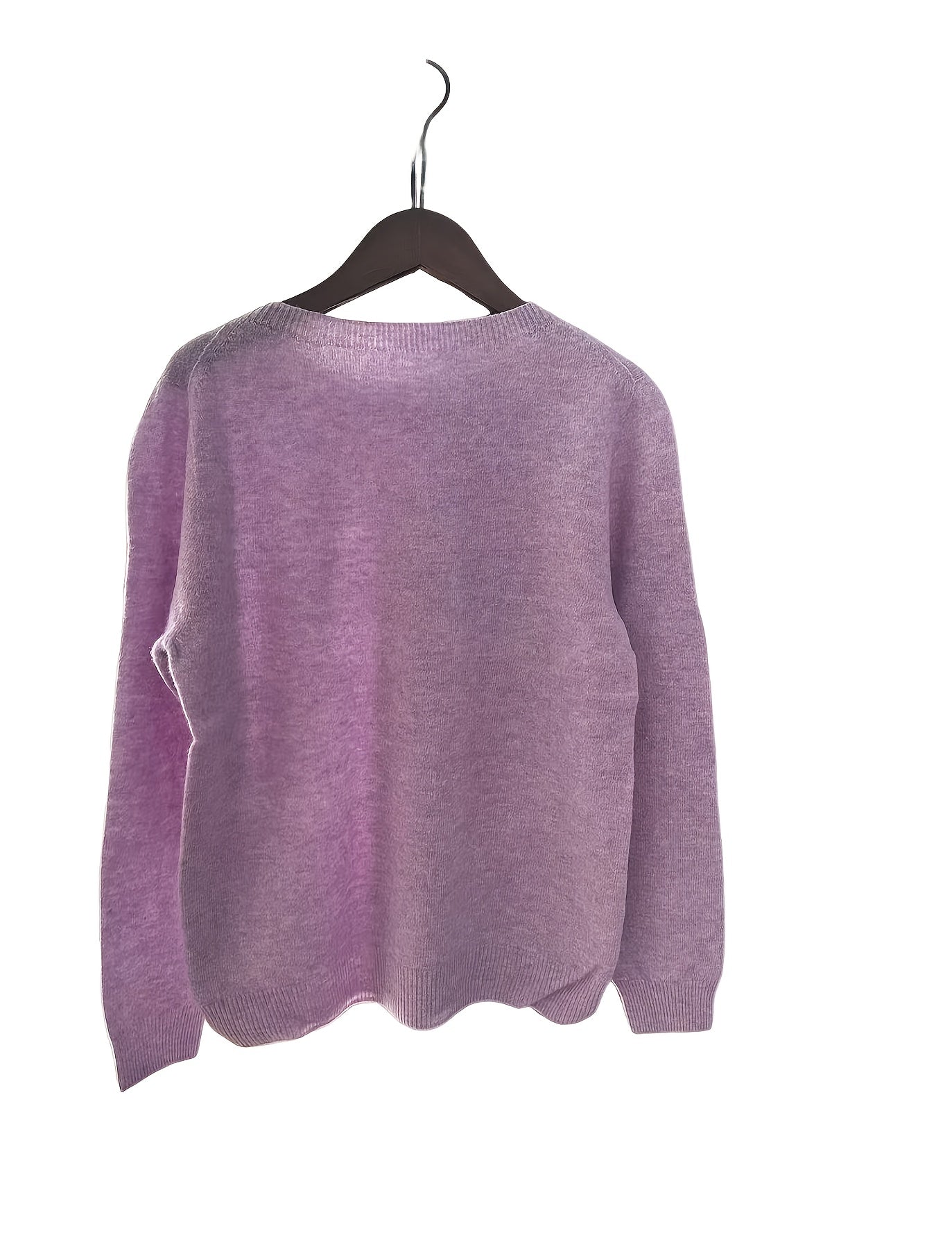 Stylish women's merino wool sweater with cozy crew neck, long sleeves, and solid color knit design for fall/winter.