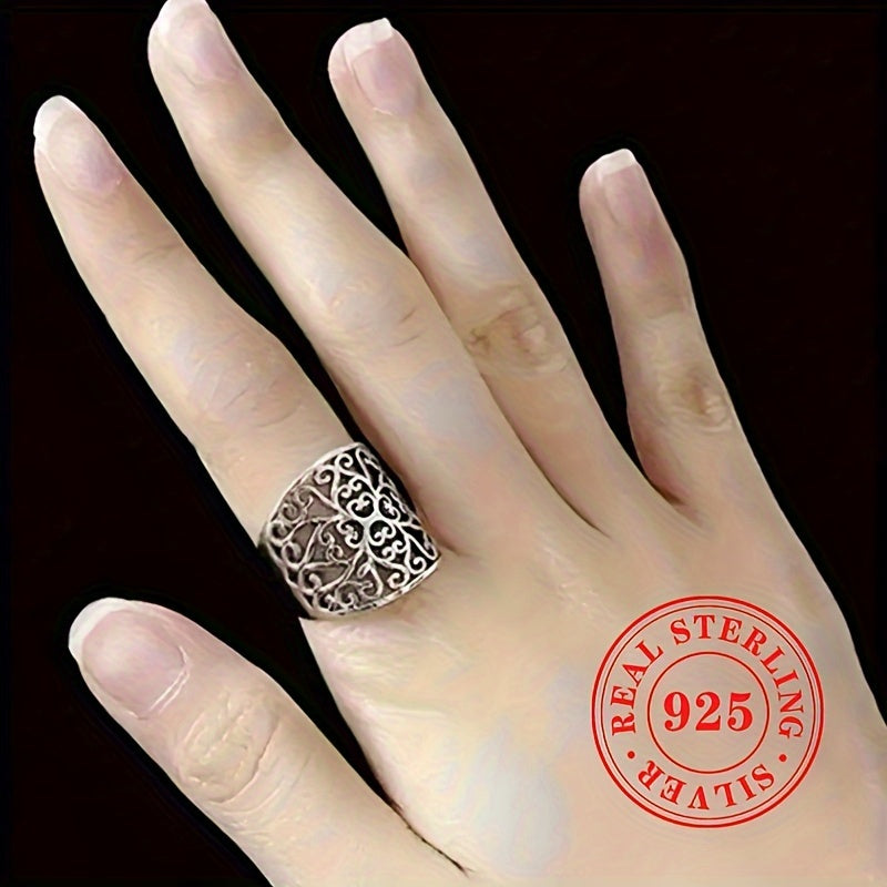 This elegant and one-of-a-kind lady's ring is crafted from high-quality S925 sterling silver, weighing 5.7 grams. It showcases a stunning hollowed-out floral vine design on the wide face, highlighting the exquisite craftsmanship behind its creation.