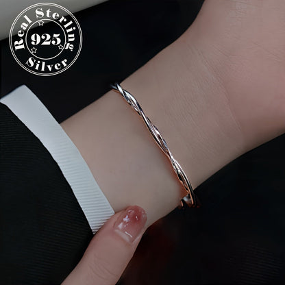 Elegant and simple twisted Möbius band bracelet for women, made of 925 sterling silver with white golden plating. This adjustable open cuff features synthetic zirconia and is hypoallergenic, weighing 9g. Perfect for daily wear or gifting.