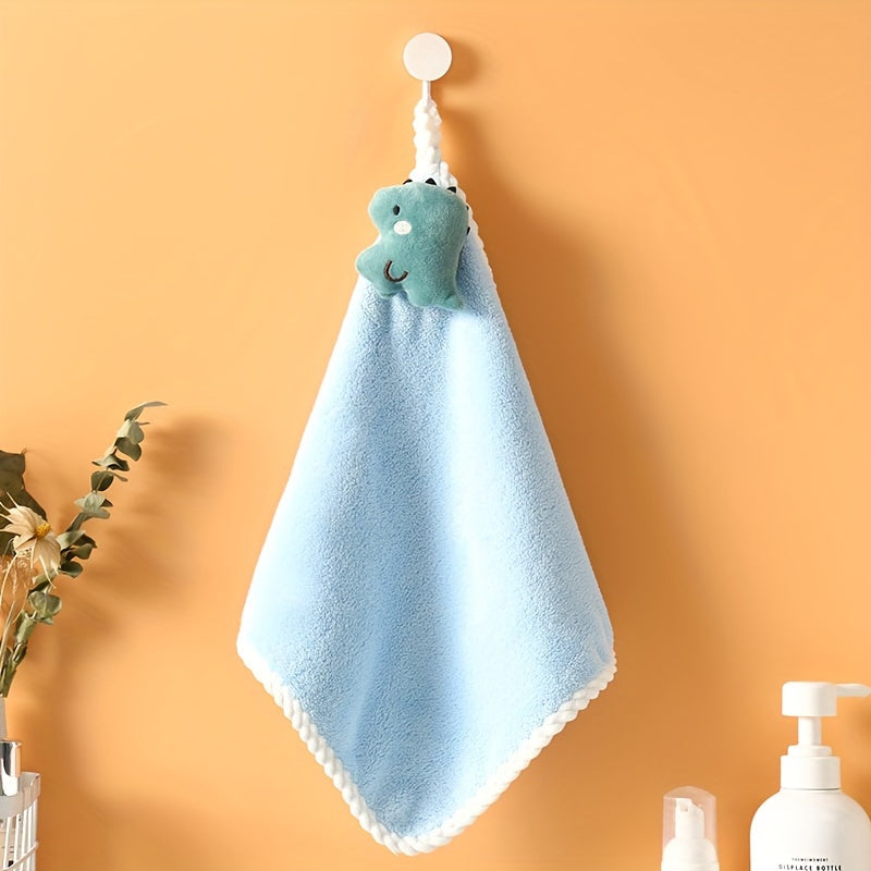 Cute dinosaur hanging hand towel made of soft coral fleece, highly absorbent and ideal for kitchen and bathroom use. Great for both kids and adults.