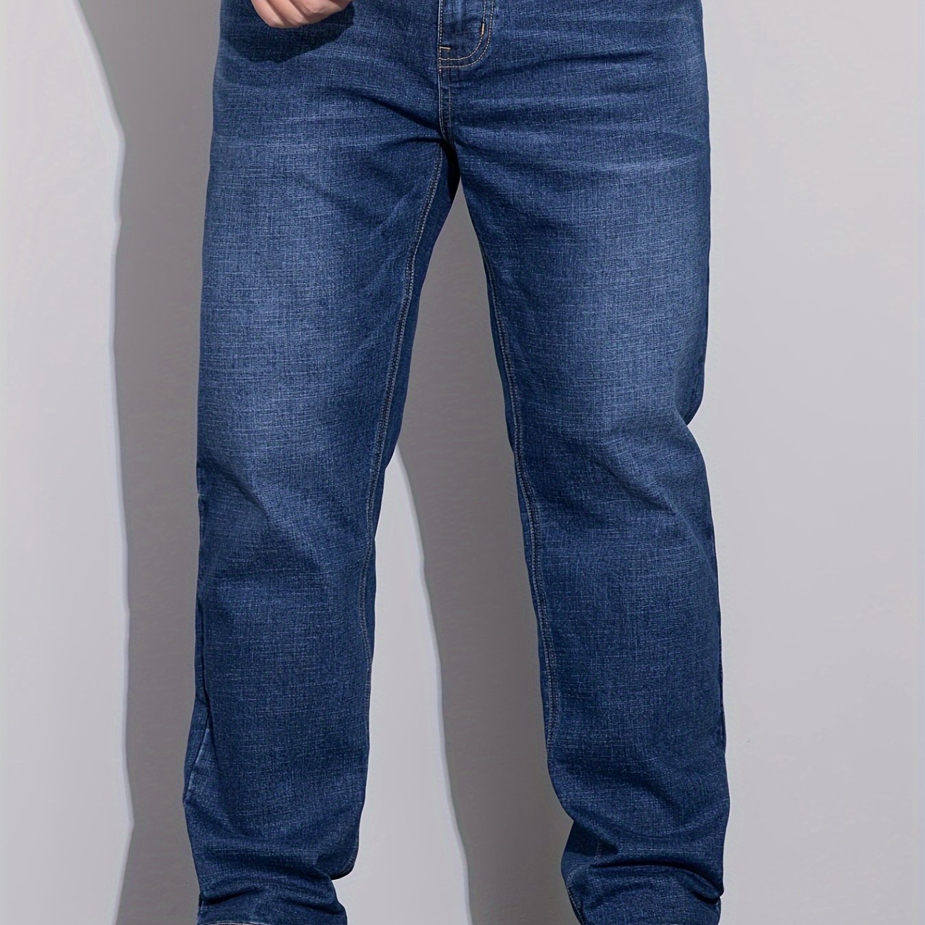 Men's stretchy cotton denim pants for all seasons, in a loose fit and plus size, perfect for business casual wear.