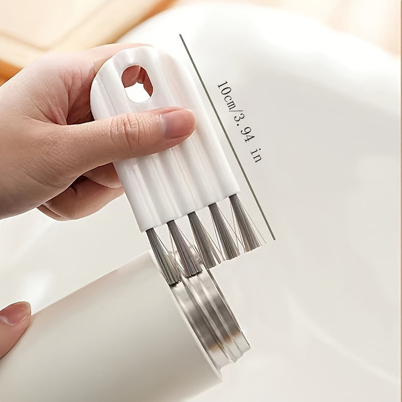 Multi-function keyboard cleaning kit with soft brush, duster, and keycap puller.