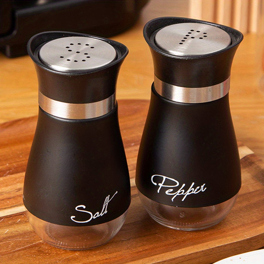 Set of two 3.4oz salt and pepper shakers for kitchen use.