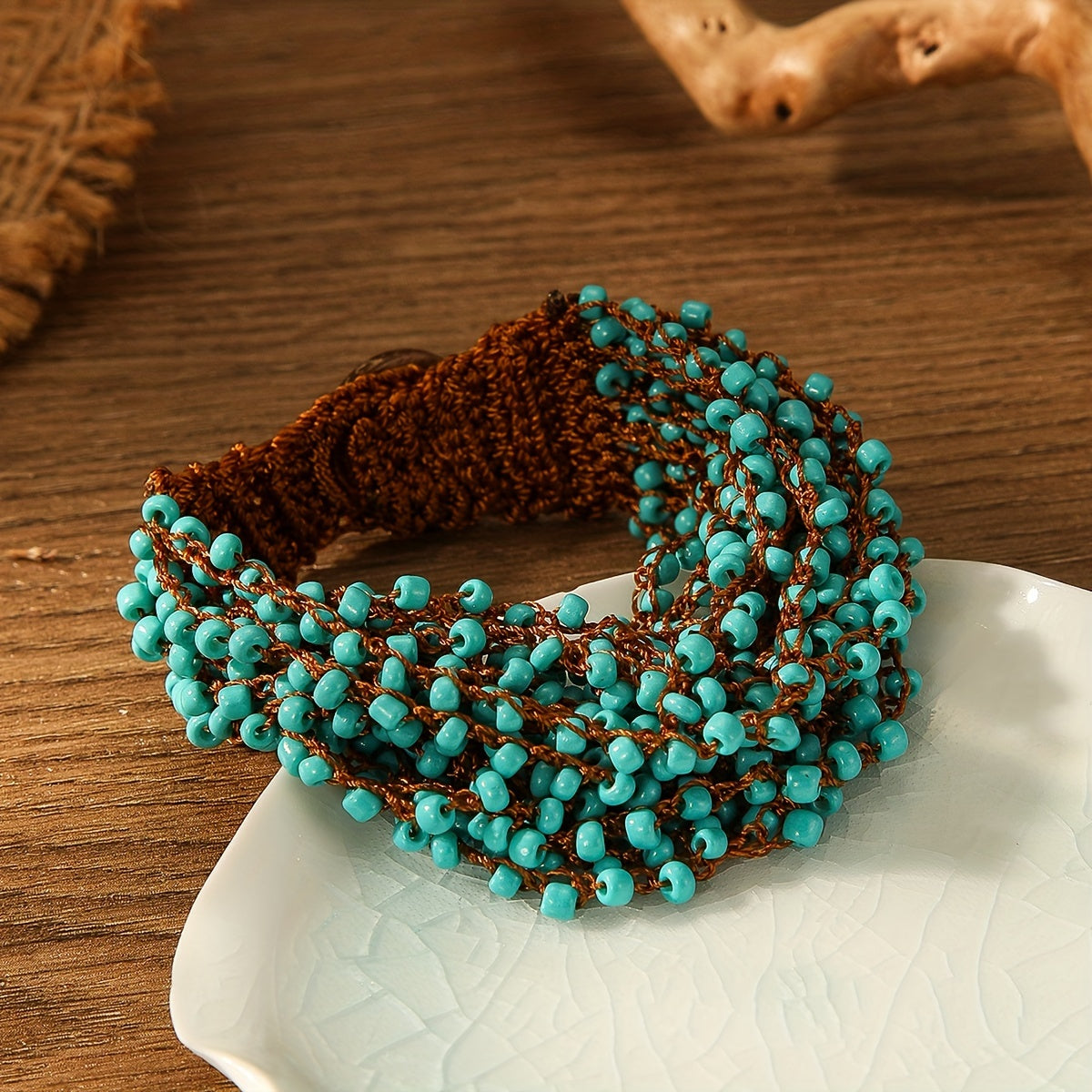 Green crochet bracelet with boho style handmade beaded details, perfect as a unique hand jewelry ornament gift.