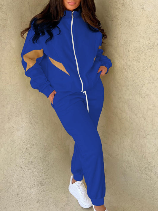 Casual sporty two-piece set for women: blue and yellow zip-up jacket with pockets and drawstring joggers made of machine washable polyester blend.