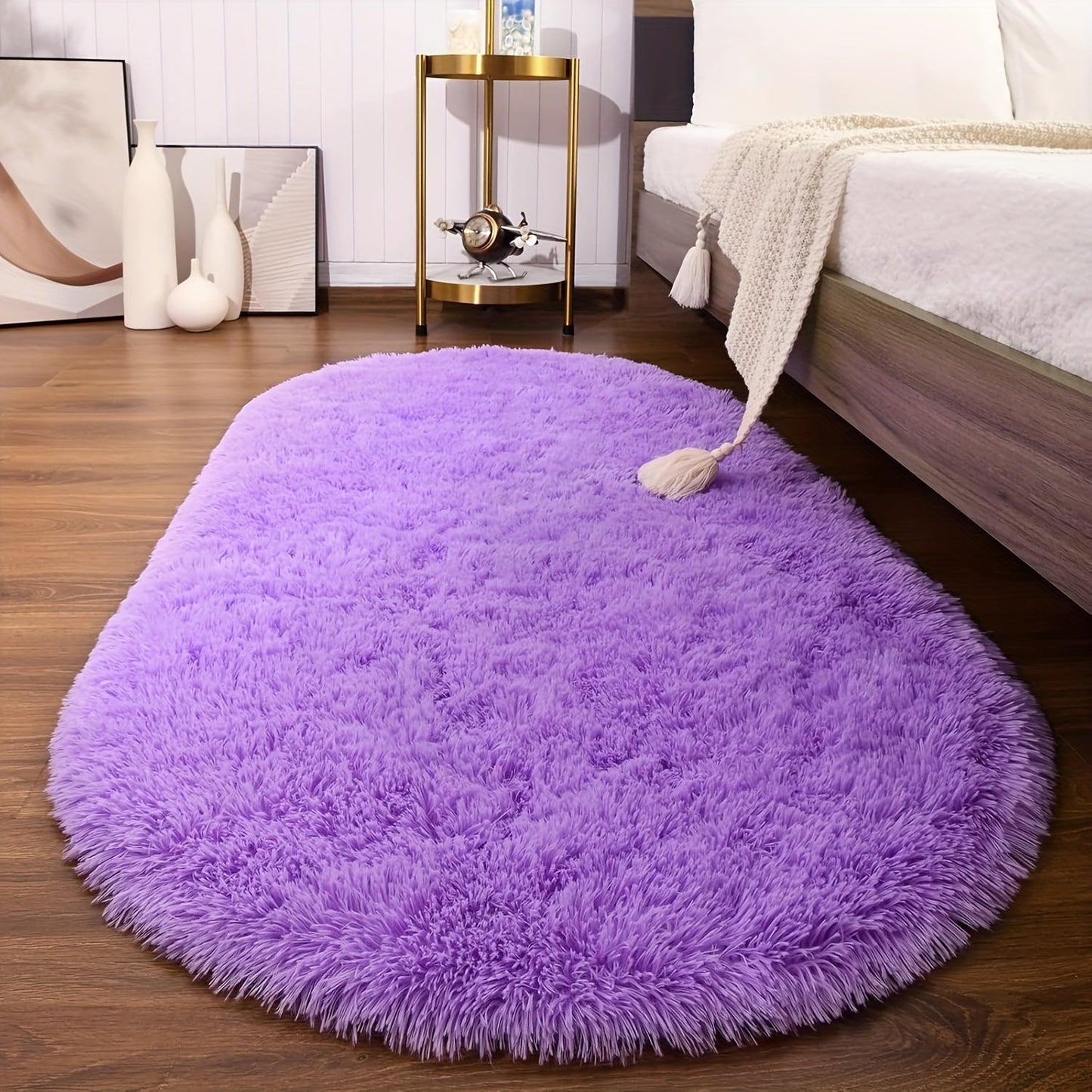 Soft and fluffy oval shaggy area rug, perfect for bedroom or living room. Made with skin-friendly thickened sponge and tufted polyester material. Durable and easy to maintain. Adds decorative touch to indoor spaces such as sofa, bedside, playroom, or