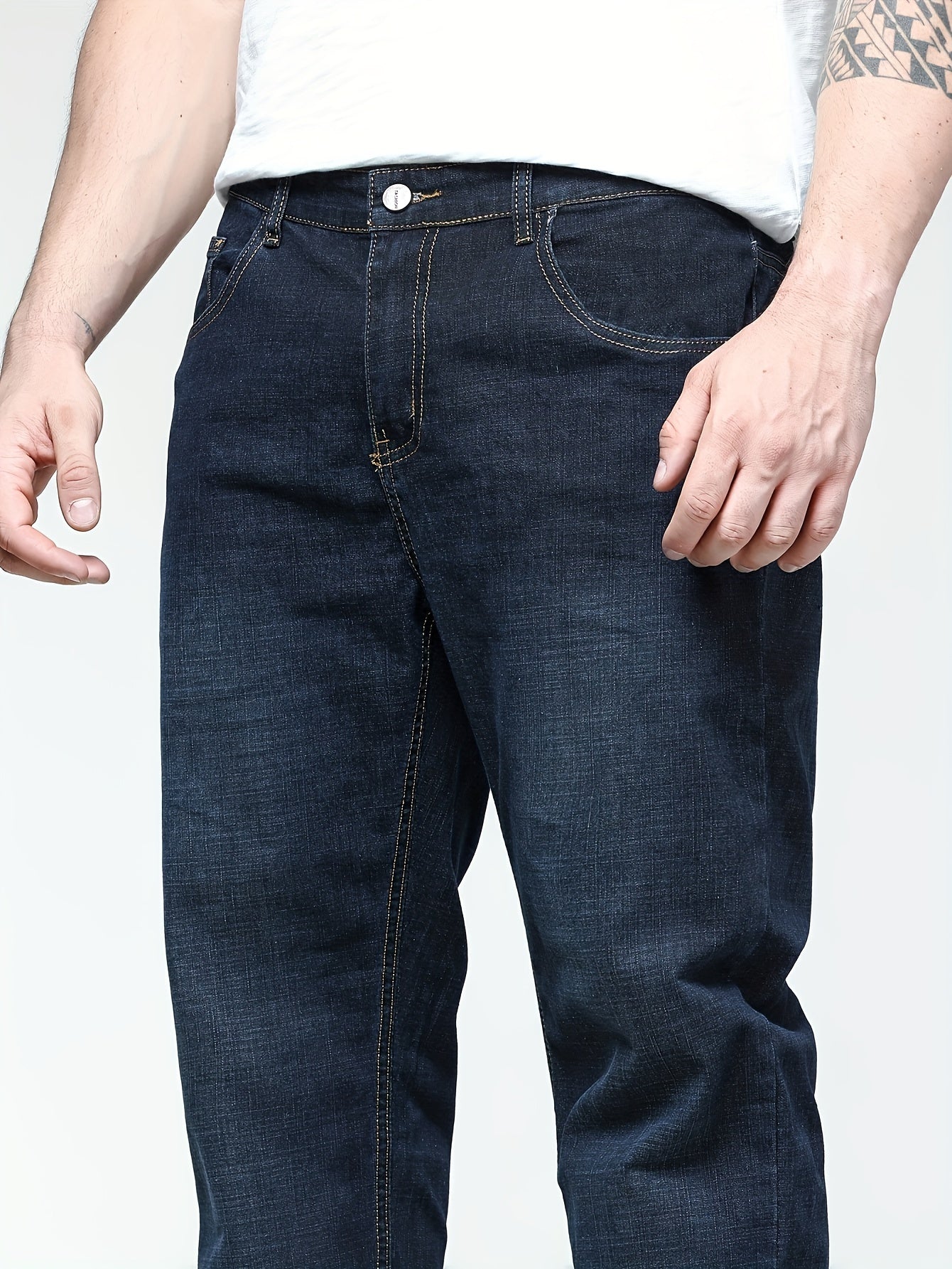 Men's solid denim pants for spring and fall in plus sizes.