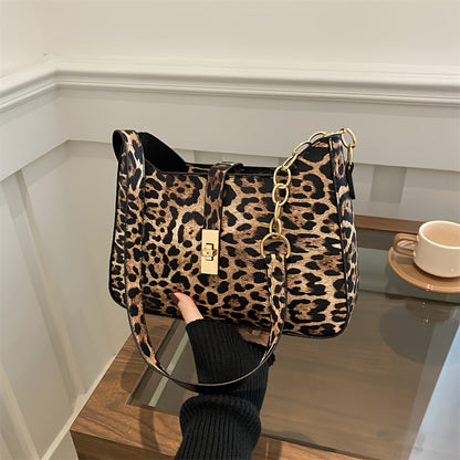 Leopard Print Shoulder Bag with classic clasp, PU strap, zip closure, and faux leather lining.