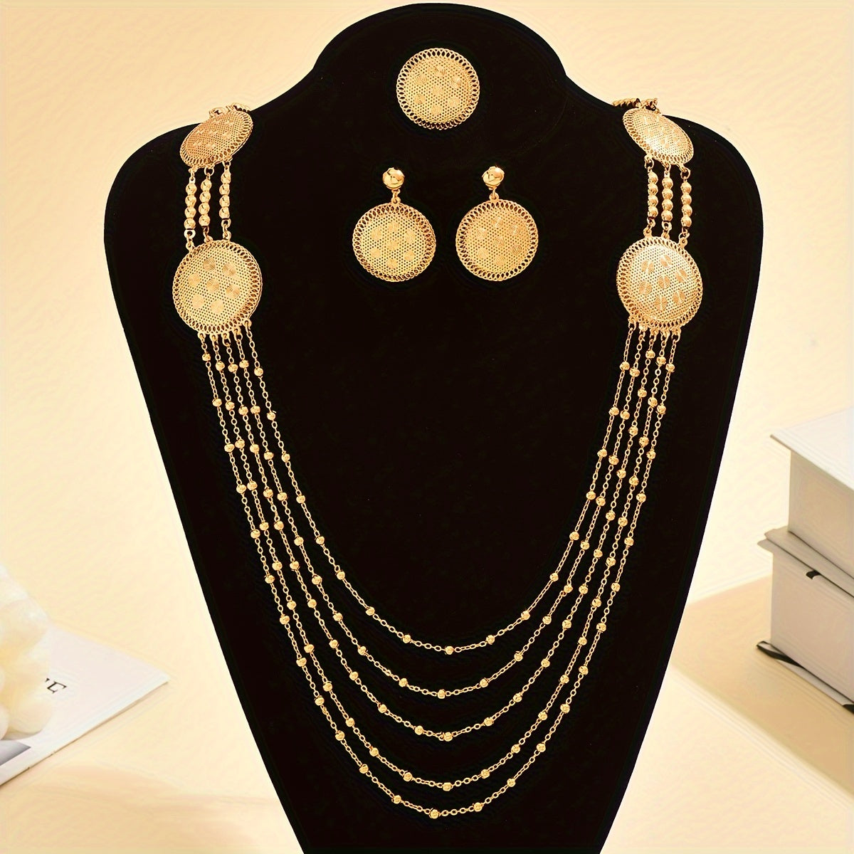 Four-piece set of stylish, luxury tassel jewelry including necklaces, earrings, and rings, perfect for women's banquets, weddings, and special occasions in the Middle East during Ramadan. Ideal for accessorizing, gifting, and adding a touch of elegance