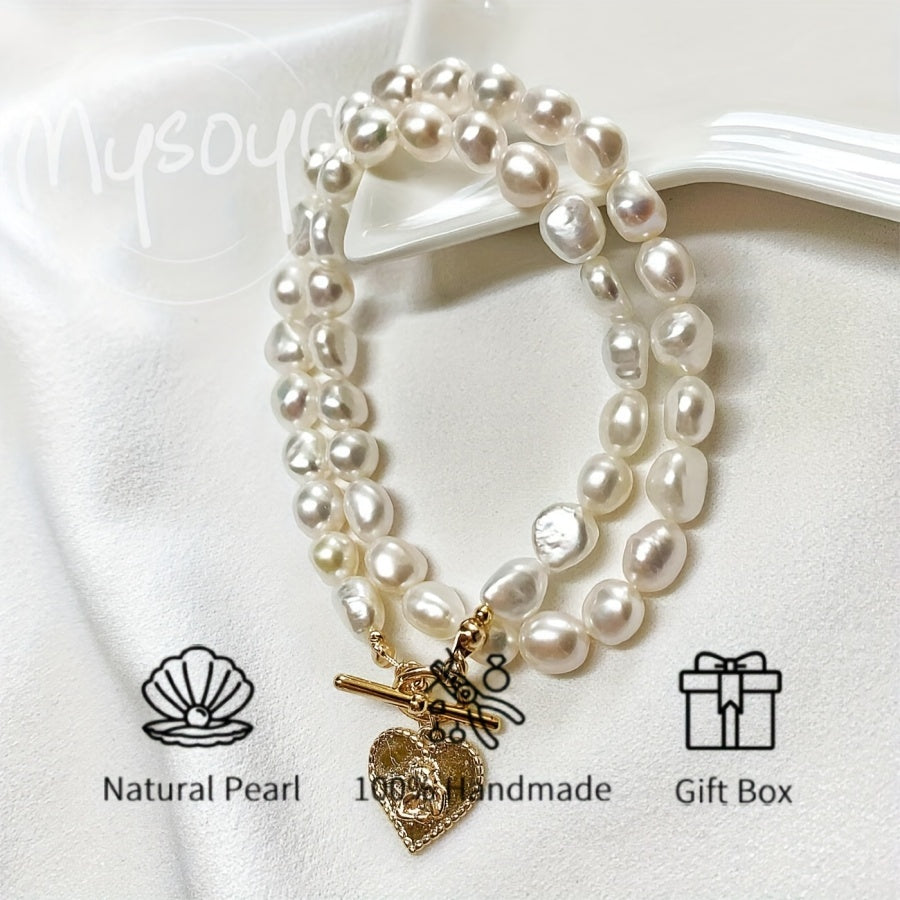 This elegant necklace features a handcrafted Baroque freshwater pearl with a golden heart pendant. Measuring 7-8mm, it comes in a beautiful gift box, making it a perfect gift for birthdays, anniversaries, Valentine's Day, and any special occasion.