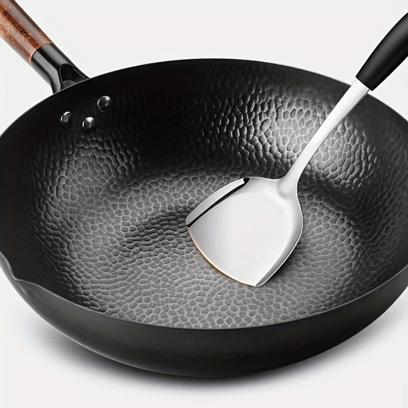 One piece of versatile cookware for all stoves - the Cast Iron Wok (32.0cm). This Stir-Fry Pan is perfect for Chinese style cooking and features a flat bottom for use on induction, electric, gas, and halogen stoves. Complete your kitchen with this