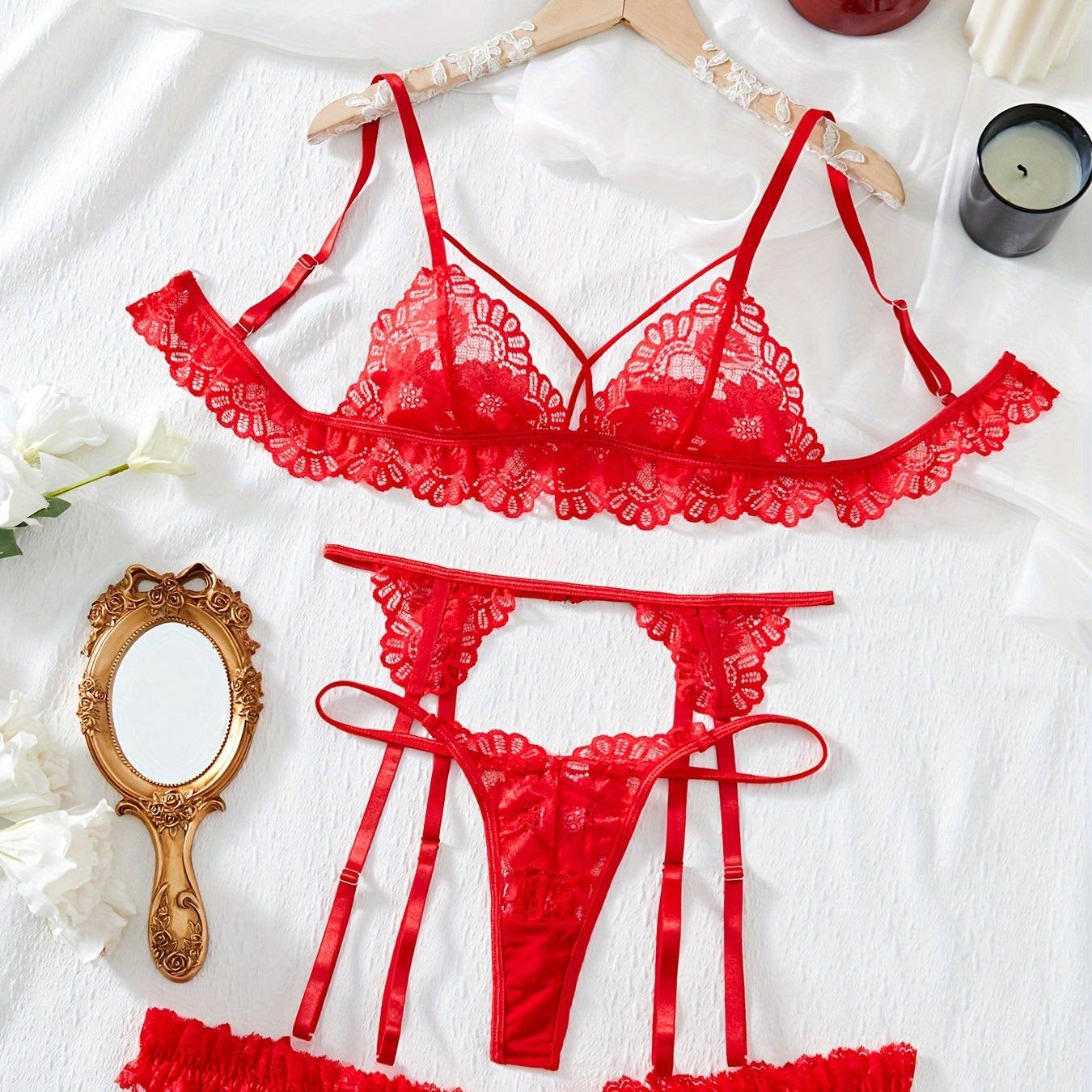 Floral lace lingerie set includes bra, thong, garter belt. Subtly sexy intimates for women.