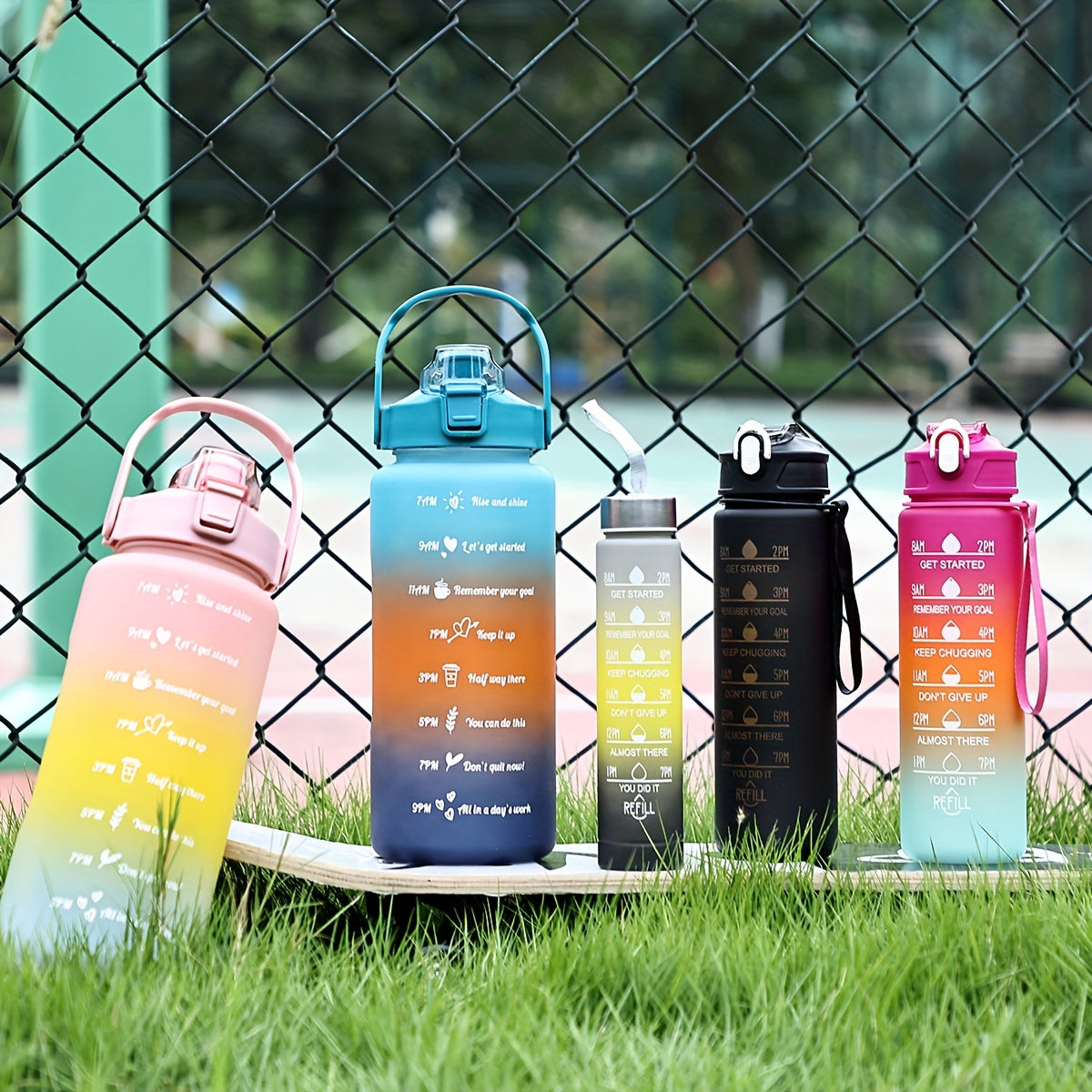 Lightweight sports water bottle with straw, gradient color, motivational phrases, large capacity, BPA-free, ideal for hiking and camping.