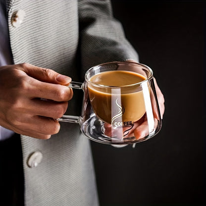 Double-walled glass coffee mug with cappuccino handle, heat-resistant, transparent, and reusable for home and kitchen.