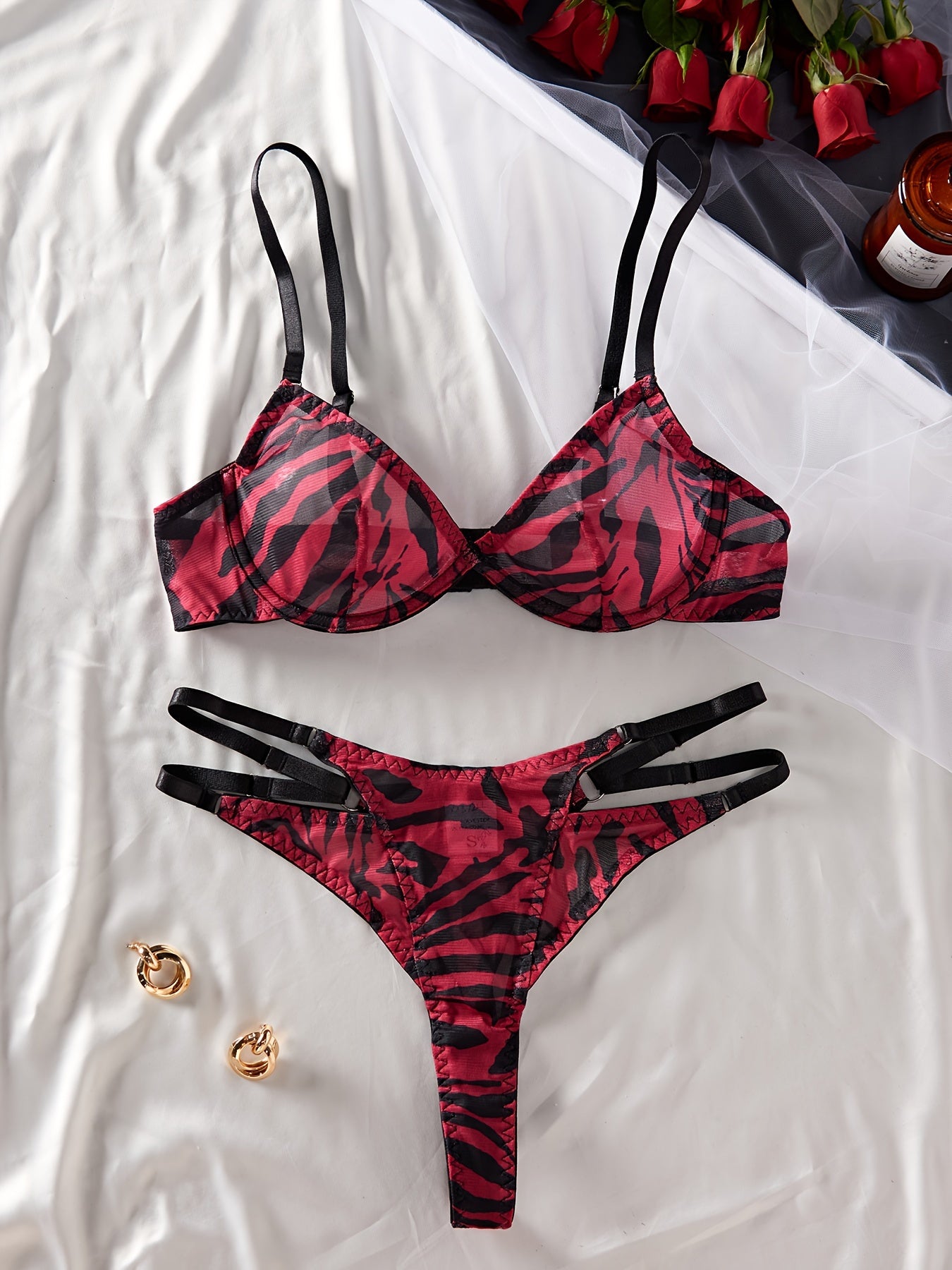 Zebra print bra and panty set with push-up bra and hollow-out panties.