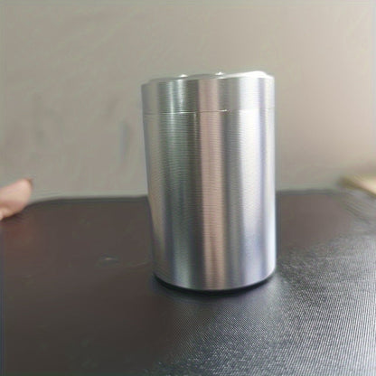 A compact stainless steel tea canister with sealed storage, ideal for on-the-go use. Packaged in a gift box, this household essential is perfect for storing tea on your travels.