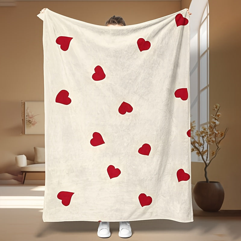 Soft sofa throw blanket featuring a red heart pattern for Valentine's Day. This cozy blanket is knit from warm polyester coral fleece and showcases a contemporary style. The digital print craftsmanship makes it perfect for use on the couch, bed, camping