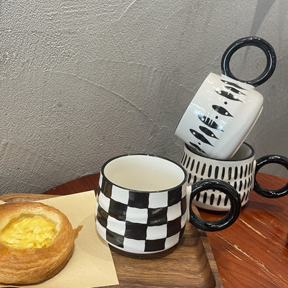 Stylish black and white checkered ceramic coffee mug - Ideal for home or restaurant use.