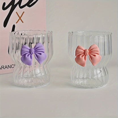 Reusable glass coffee cup with bow design. Suitable for tea, lemonade, and various beverages. Hand wash only. 1 glass cup included, no straw.