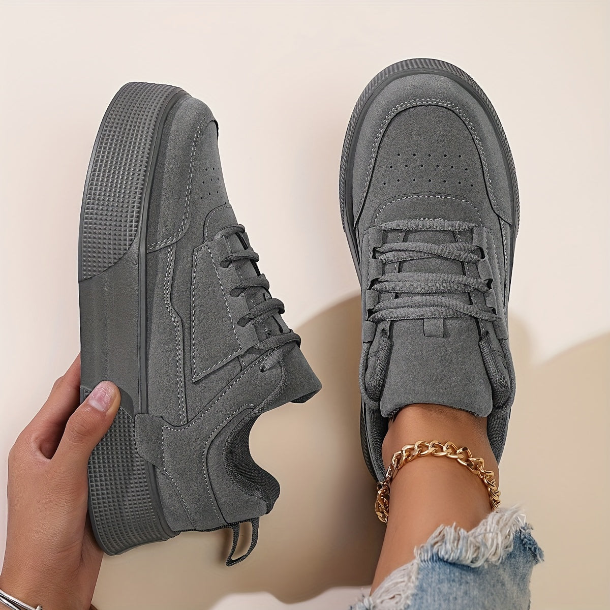 Classic lace-up low top skateboard sneakers for women, with solid color block design and height increase feature. Made with PU upper, fabric inner, and EVA sole for comfort in all seasons.