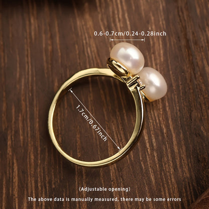 This elegant and unique pearl ring is the perfect accessory for women. It features two 6-7mm natural freshwater pearls on an open ring design, making it a fashionable and personalized piece. Ideal for weddings or as a special gift, this ring comes