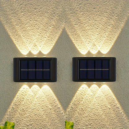 2 solar LED lights for outdoor decoration, easy to install on garden walls.