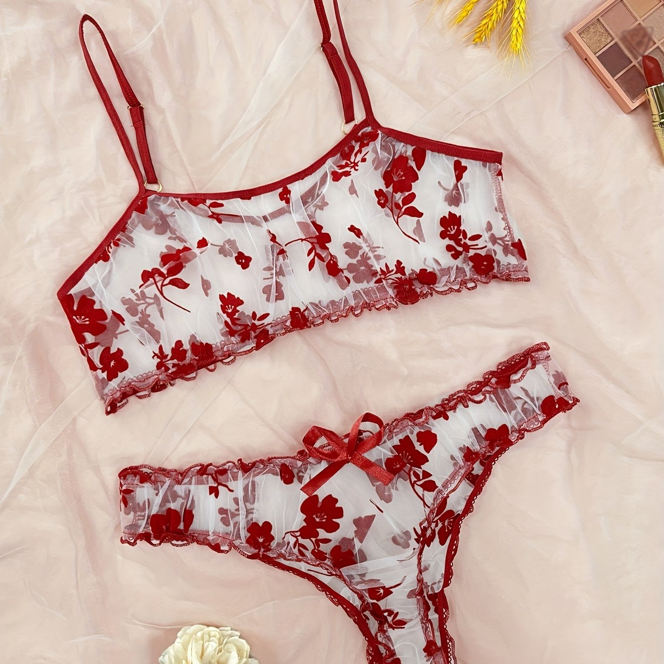 Lingerie set with floral print tulle, see-through bow bra, and tempting thong.