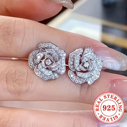 These stunning stud earrings are crafted from 4.4g of 925 sterling silver and feature synthetic zirconia stones. The elegant rose flower design exudes luxury and sophistication, making them a perfect accessory for daily wear or special occasions like