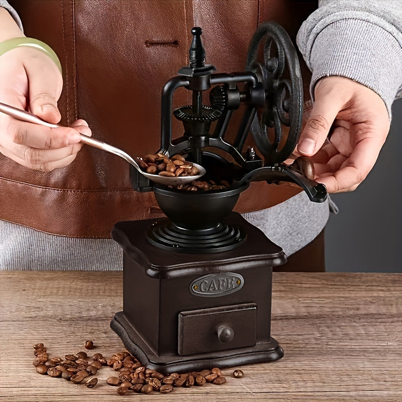 One piece traditional manual bean grinder with an original wood and vintage metal design, featuring a hand-crank shake wheel for grinding coffee beans. This portable household tool has a ceramic core for precise grinding. Makes a great gift for