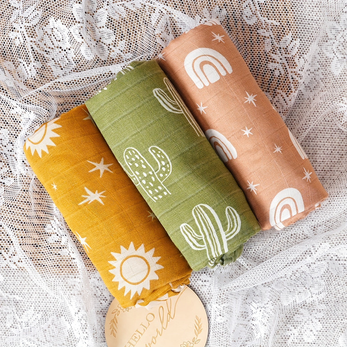 Three Elinfant Swaddle Blankets made from bamboo cotton muslin for newborns. These soft gauze bath towels are recommended for hand washing only and are suitable for children aged 0-3 years old.