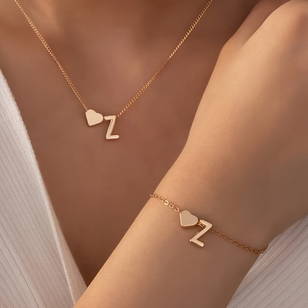 Chic two-piece set with metal heart and letter necklace and bracelet, ideal for daily wear.