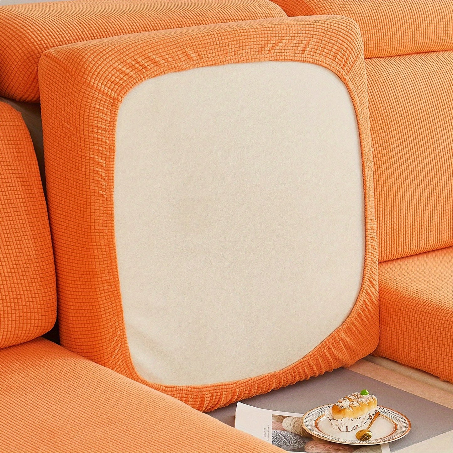 Durable sofa cover protects furniture from spills and stains.