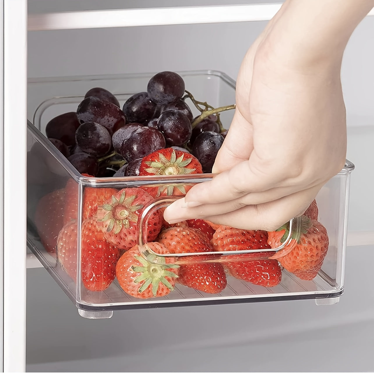 Lachesis Stackable Refrigerator Organizer Bins Set includes 2 large and 2 small bins, made of clear plastic with handles. These bins are versatile and can be used in the fridge, freezer, pantry, cabinets, drawers, or shelves for organizing fruits and