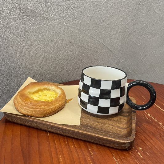 Stylish black and white checkered ceramic coffee mug - Ideal for home or restaurant use.