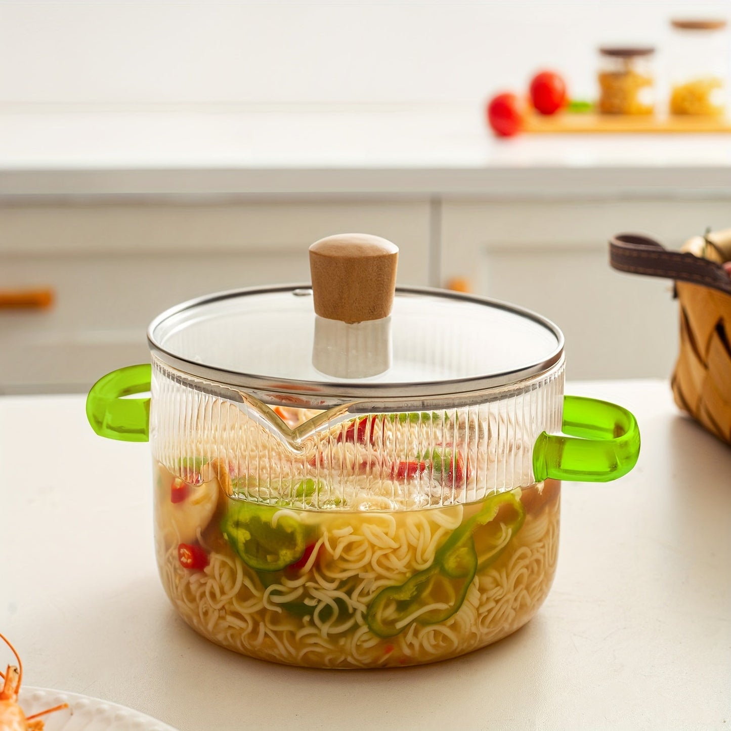 Glass cooking pot set includes two pieces with lids. The transparent glass pot is perfect for cooking various dishes such as noodles, Italian pasta, soup, and milk-based foods. Features a covered stew pot with double handles for easy handling in the