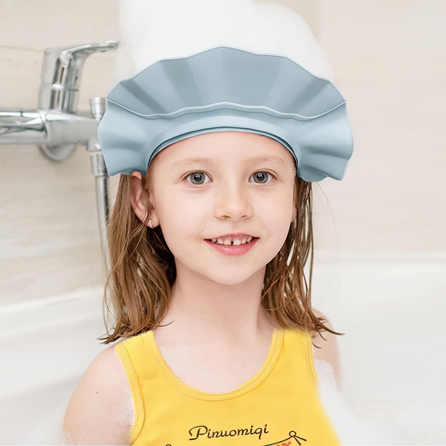 Keep your baby's eyes and ears safe with this adorable adjustable shampoo shower cap for baby showers.