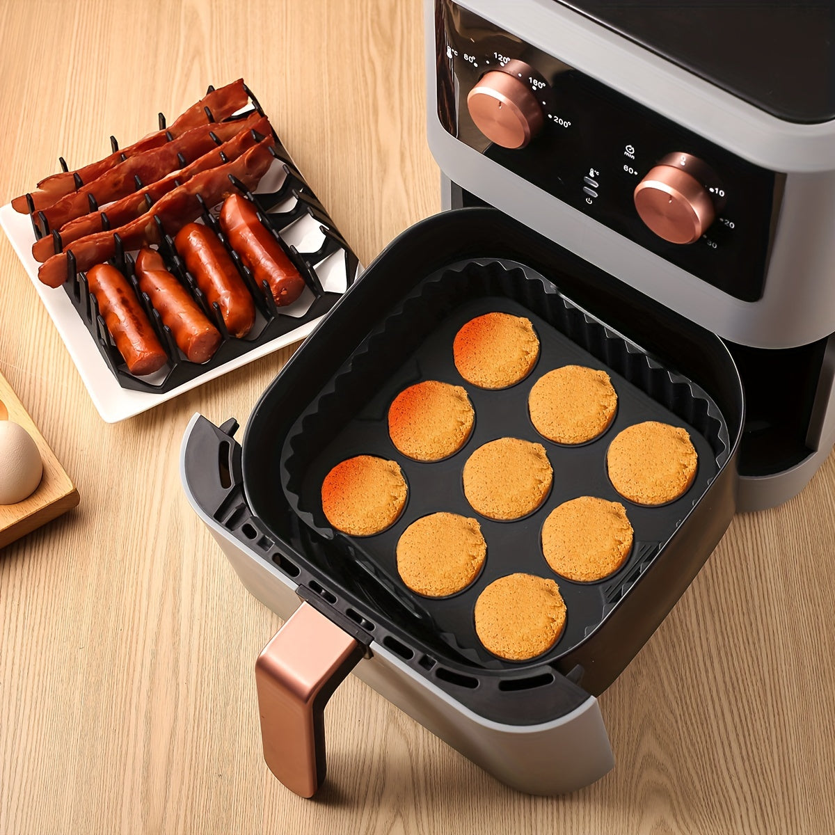 1 set of square silicone air fryer accessories, including a 19.0 cm bacon & hot dog rack, a 9 cavity cake mold, and an air fryer liner. These accessories are BPA-free, dishwasher safe, and compatible with 7QT+ air fryers in black color.