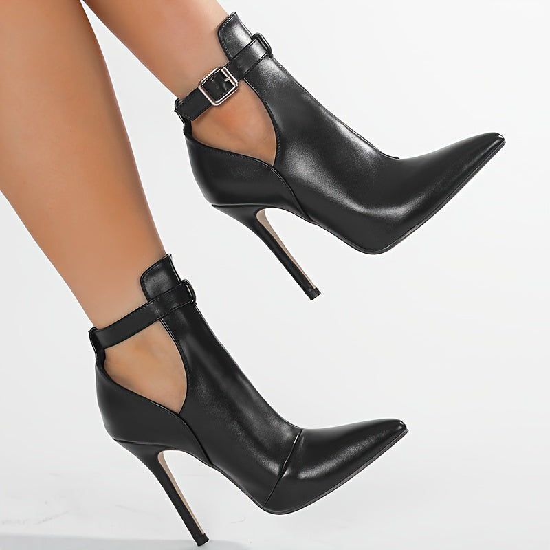 Stylish ankle bootie with buckle closure, pointed toe stiletto heel, rubber sole, and fabric insole. Made in Huizhou.