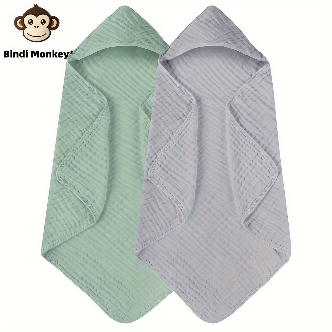 Two-pack of Bindi Monkey hooded baby towels made from 100% cotton for superior absorbency. These towels feature a cozy hood, perfect for infants and toddlers aged 0-3 years. Soft and comfortable, they can also be used as a swaddle blanket. Please hand