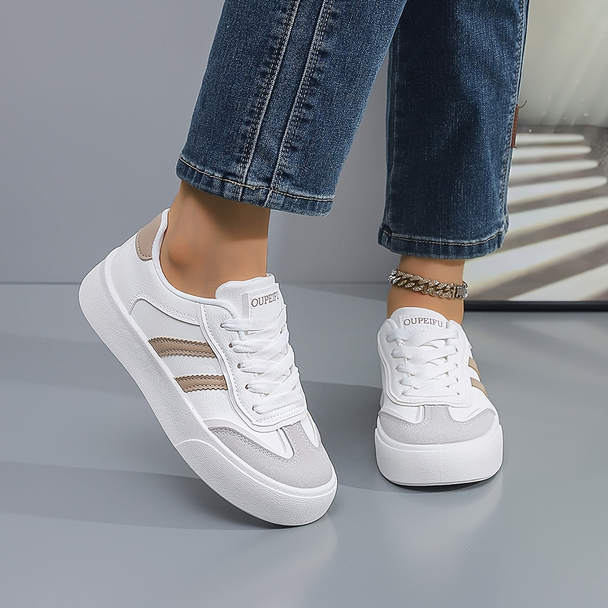 Women's lightweight white sneakers with beige accents are comfortable all-season footwear with a trendy classic design.