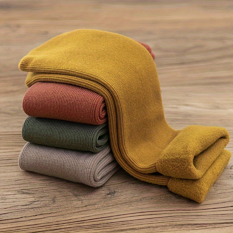 4 pairs of cozy thermal snow socks perfect for winter, lined with fleece for extra warmth, great for casual wear.