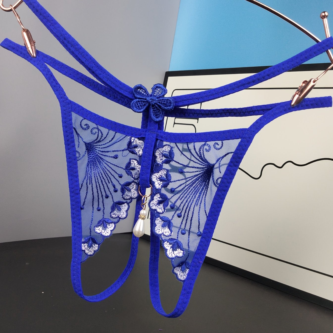 Sexy embroidered mesh thong with open crotch and free pearl, perfect for ladies seeking a tempting and breathable style.