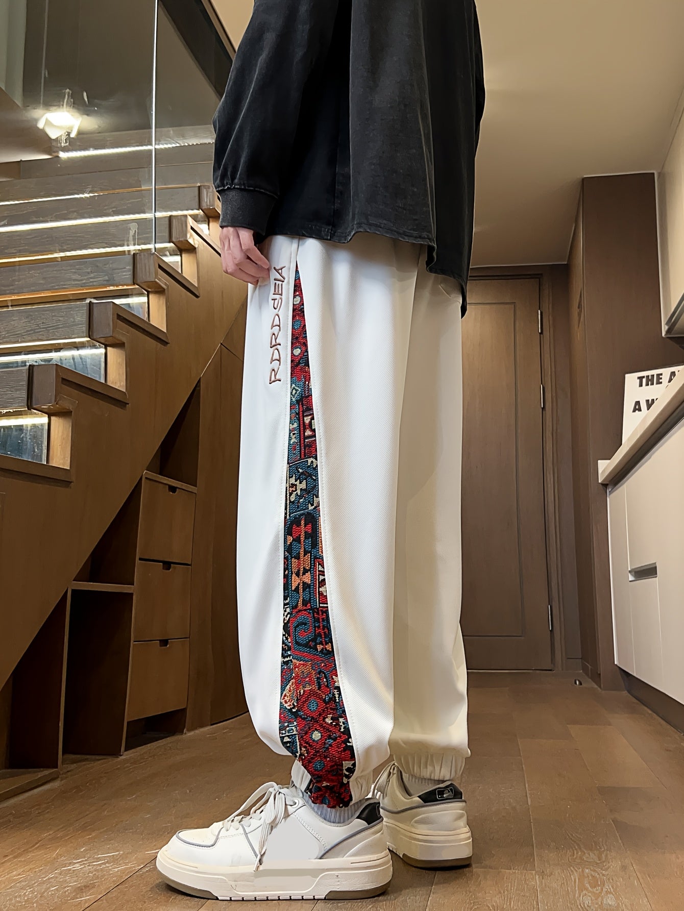 Men's stylish long pants with ethnic style patchwork and letter embroidery, casual jogger sports trousers.