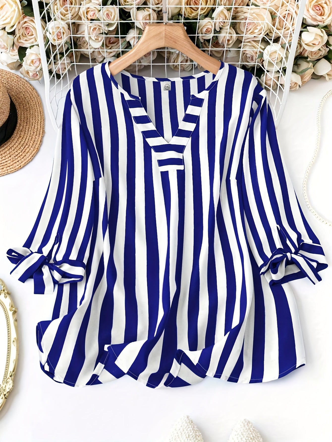 Elegant plus size striped print blouse with notched neck tie cuff for spring.