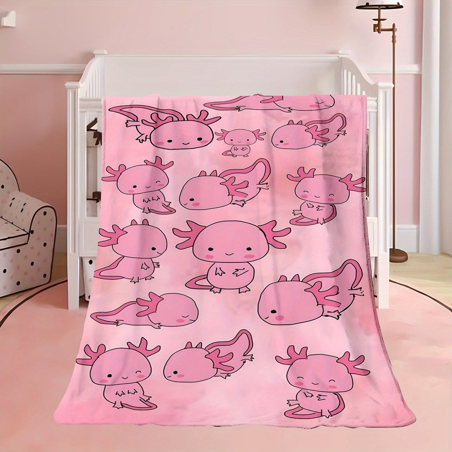 Soft, warm, and lightweight pink cartoon salamander print fleece blanket made of comfortable polyester flannel. Ideal for travel and versatile for all seasons, this contemporary style blanket is the perfect gift for boys, girls, and adults. Machine